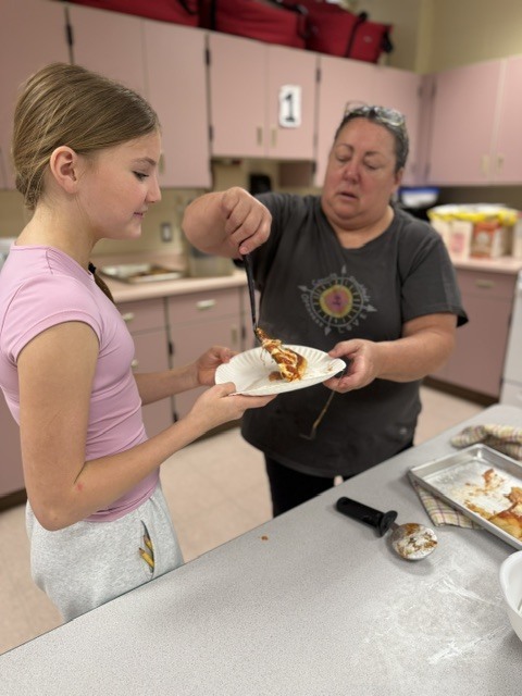 student and teacher with pizza