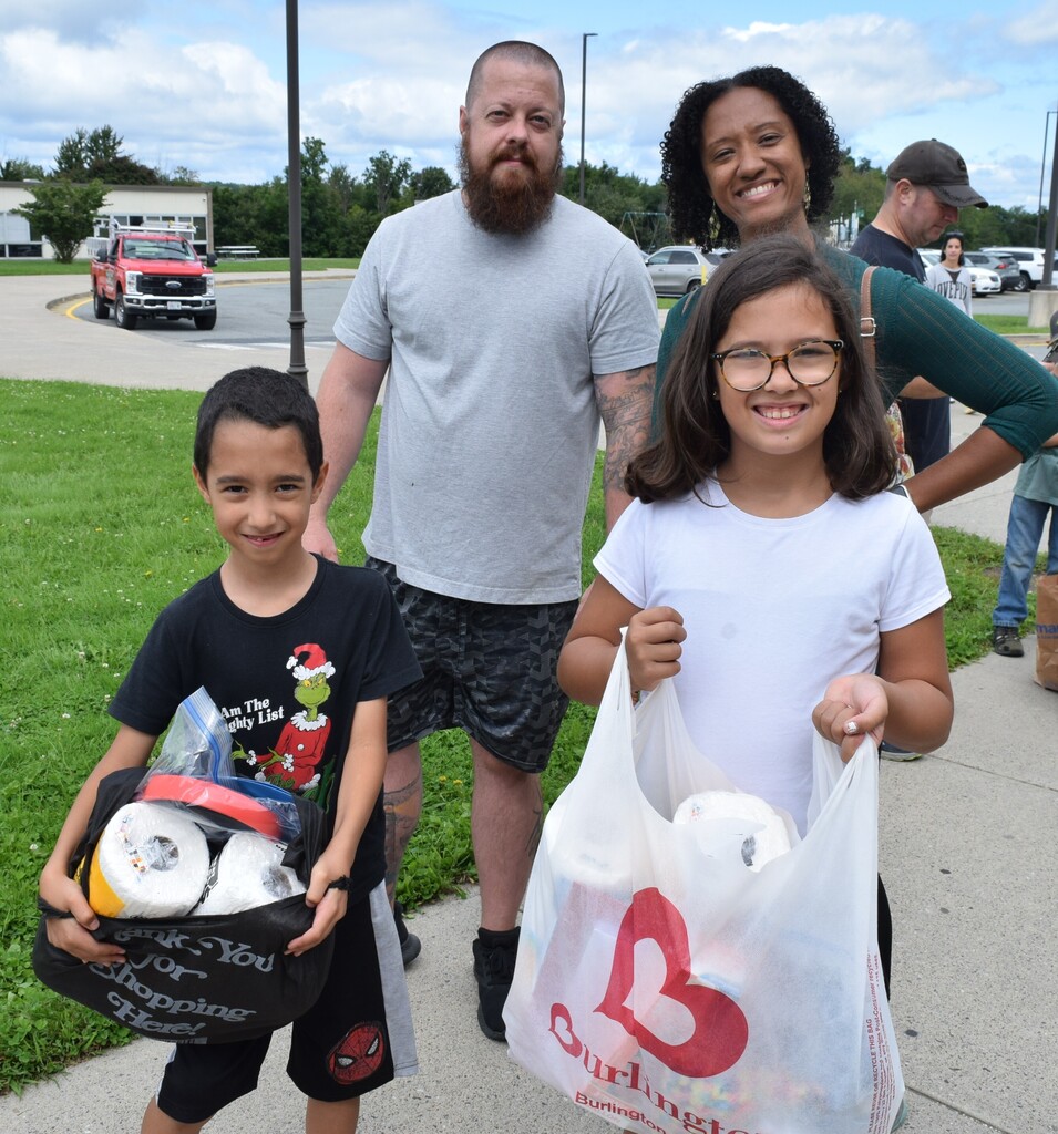 parents and kids with supplies