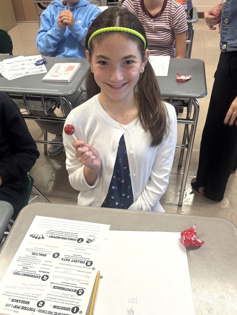 student with lolly pop
