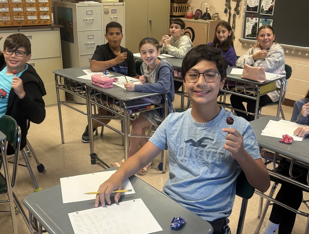 students with lolly pops