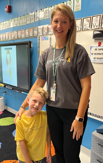 student with teacher aide