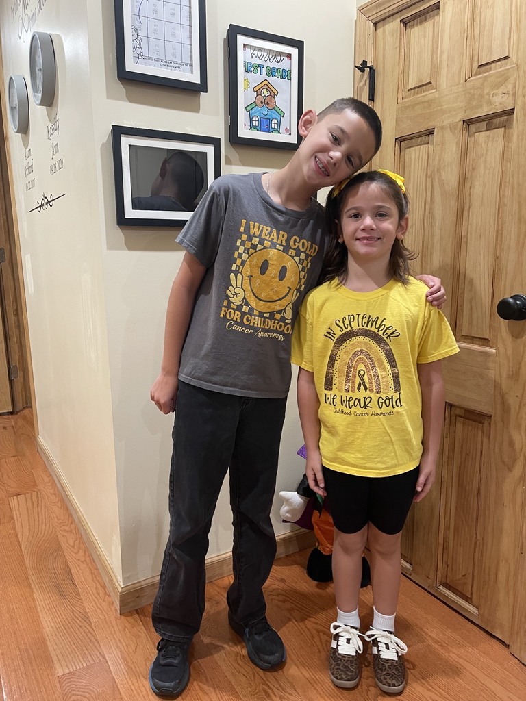 students in gold attire