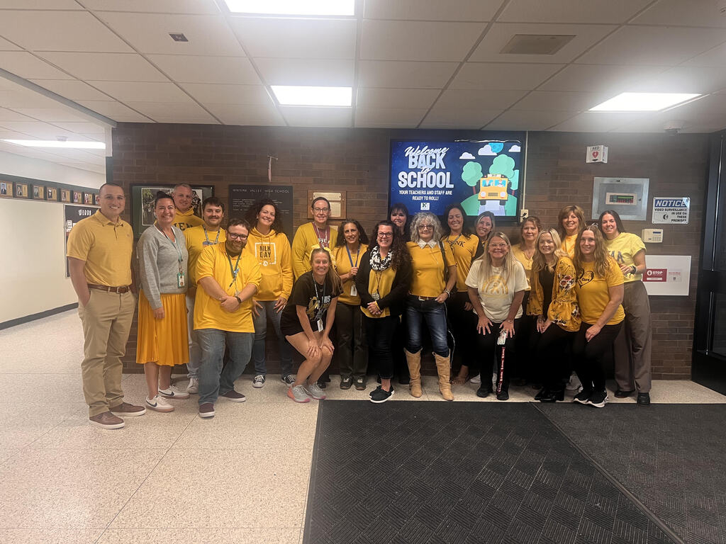 faculty in gold attire