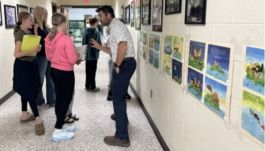 students in hallway with teacher