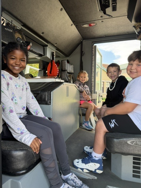 students in fire truck