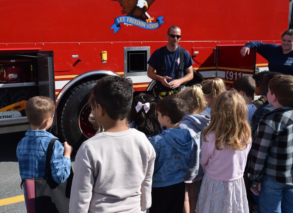 students and firefighter
