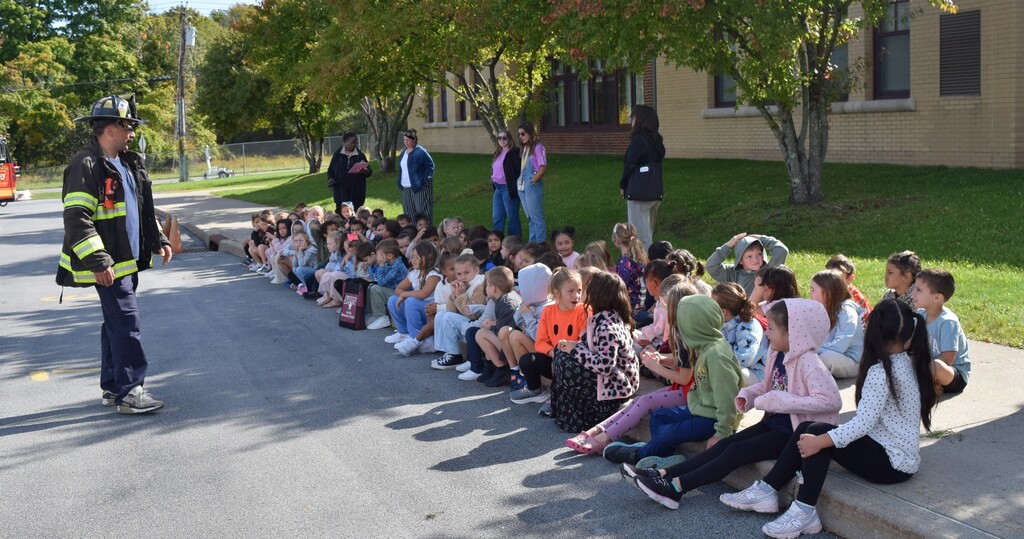 students and firefighter