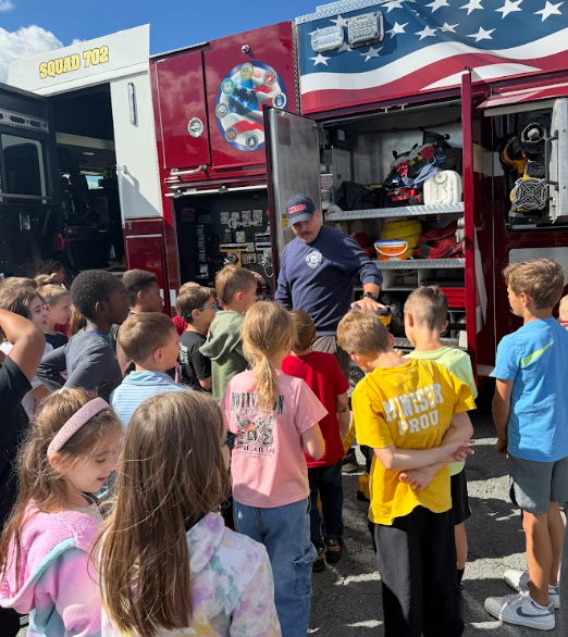 students with firefighters