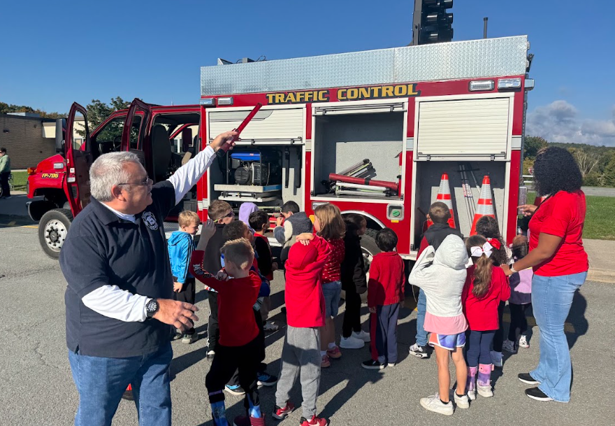students with firefighters