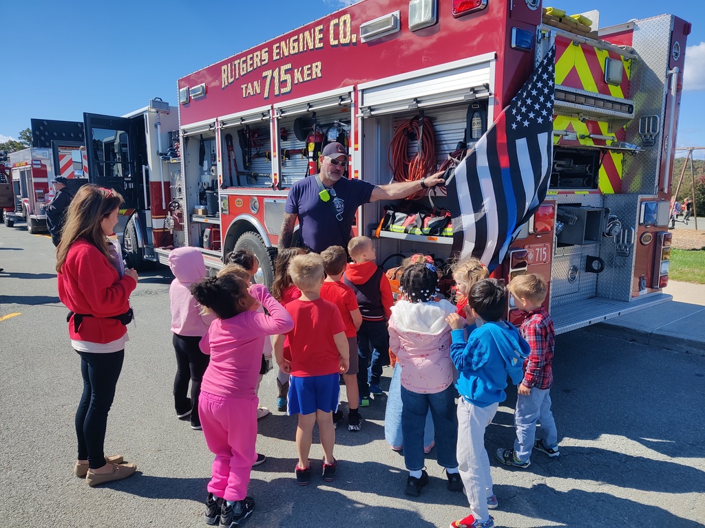 students with firefighters
