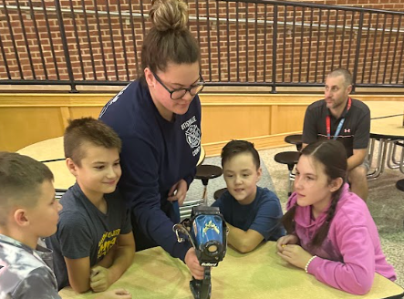 students with firefighters