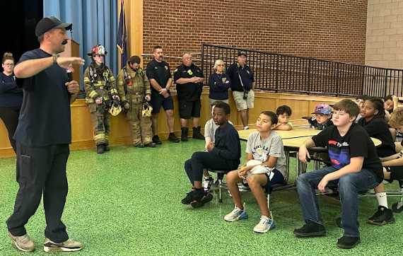 students with firefighters