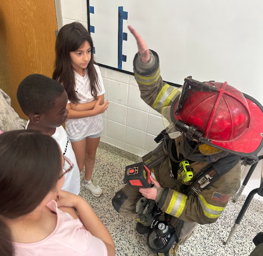students with firefighters