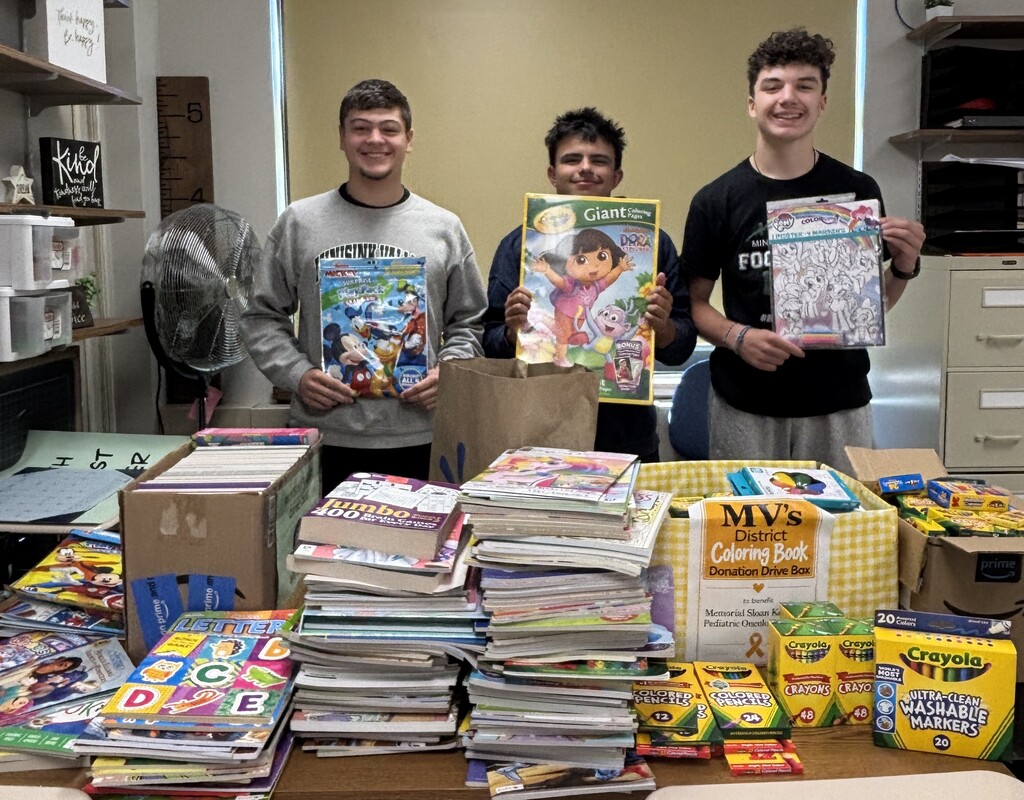 students with coloring books