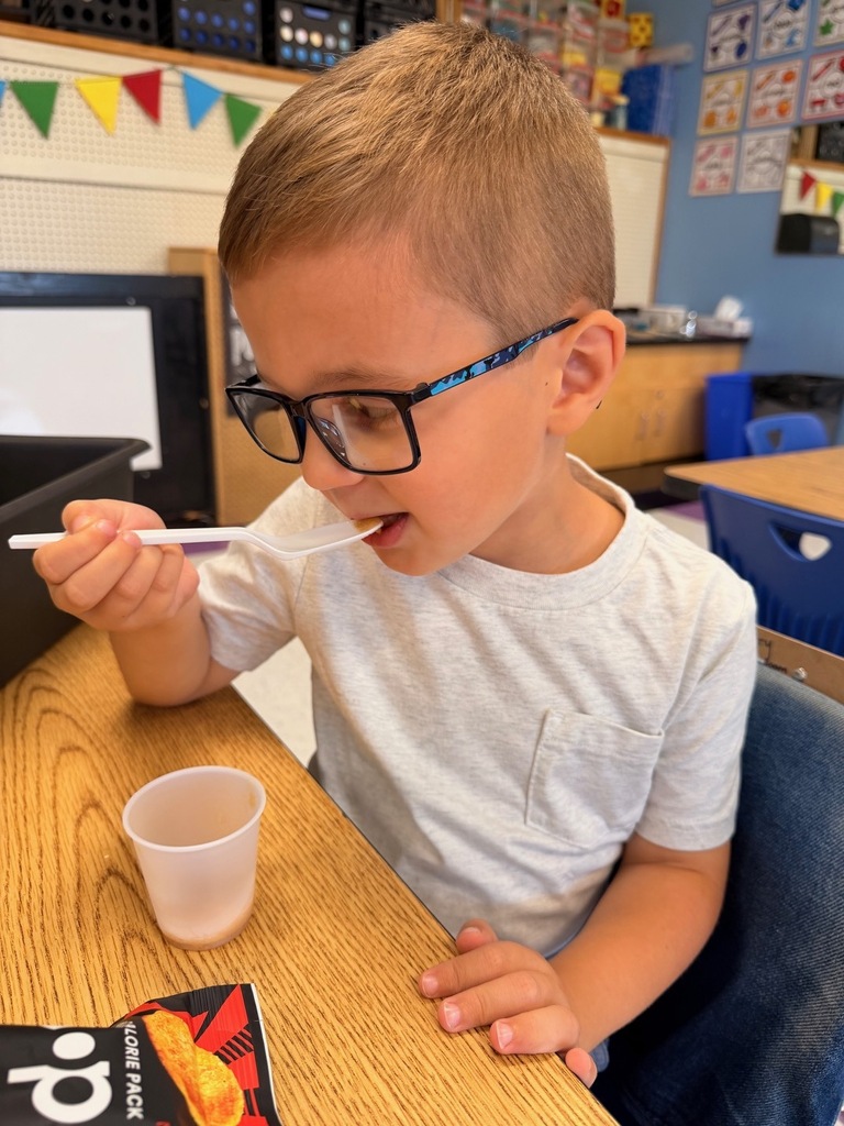 student with apple sauce