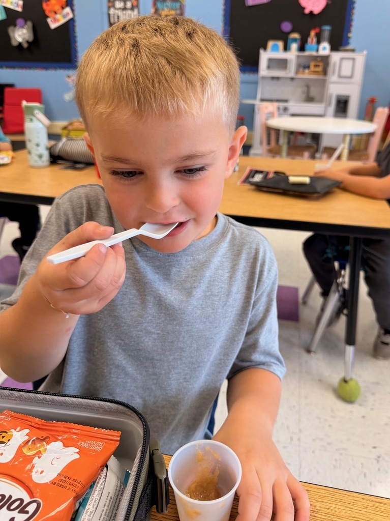 student with apple sauce