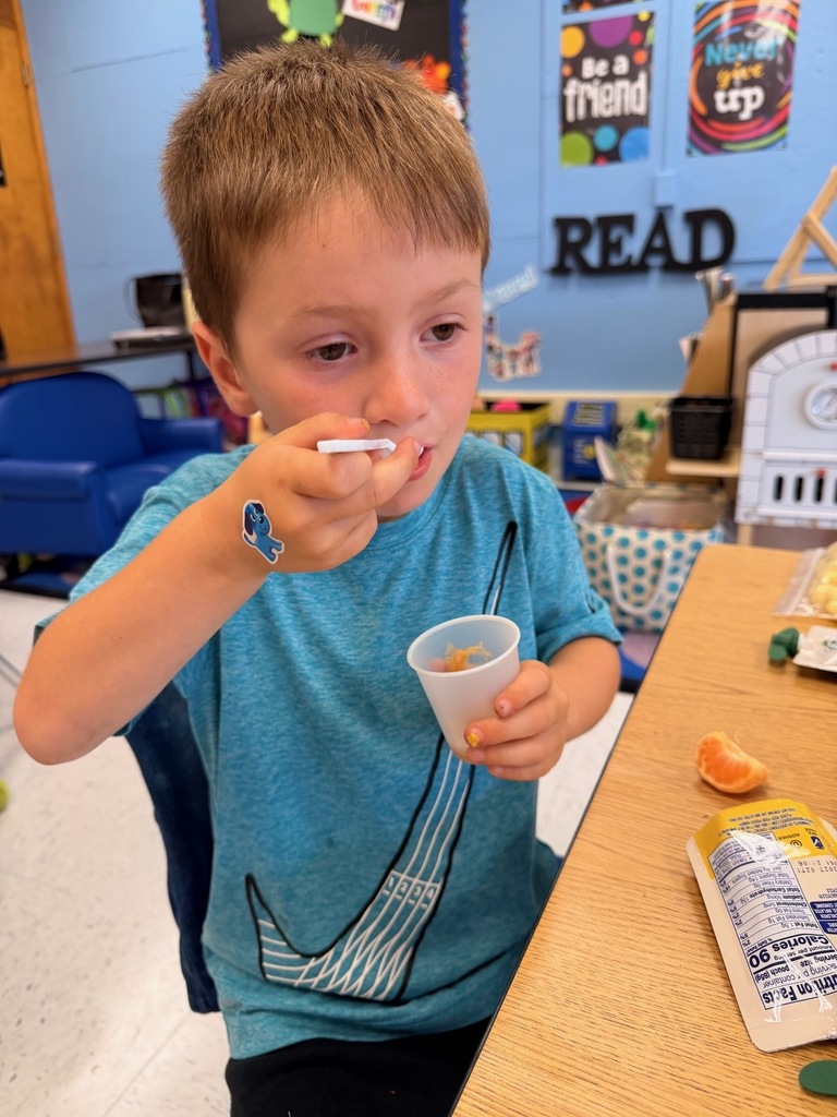 student with apple sauce