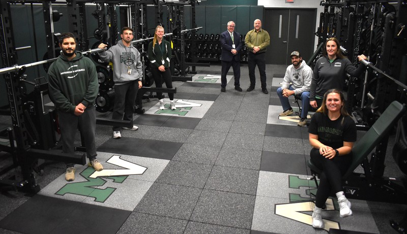 teachers and administrators in weight room