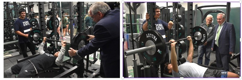 students using weight room equipment
