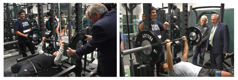 students in weight room with adults