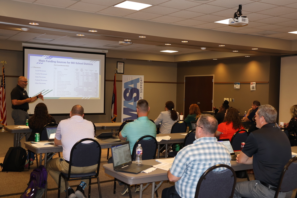Dr. Cummins teaches the class on school finance