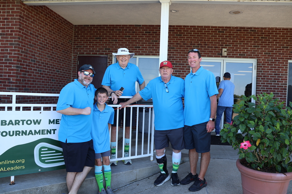 Team of golfers in all blue.