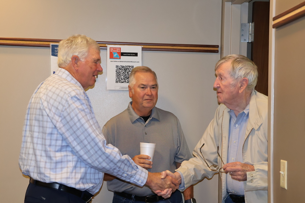 Two men shaking hands.