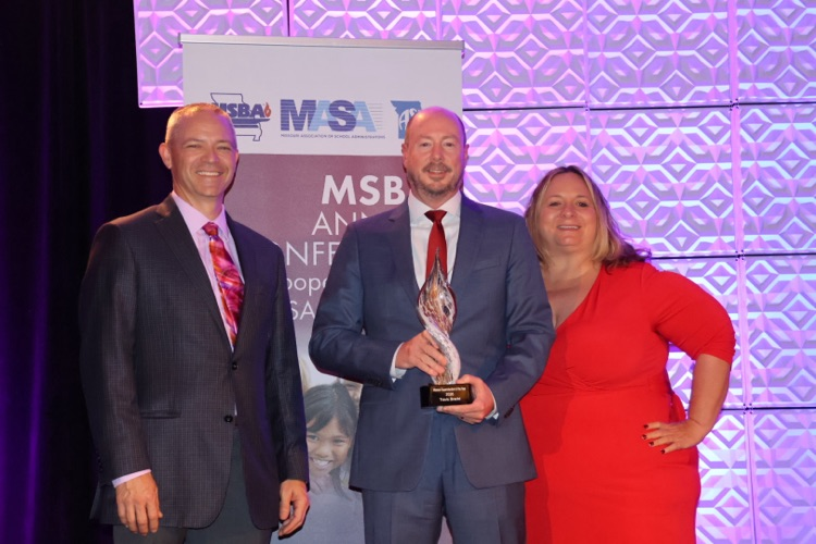 Dr. Bracht with board members