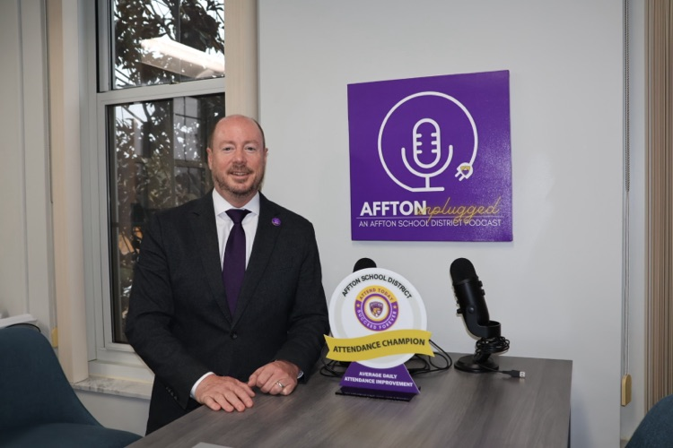 Dr. Travis with podcast equipment