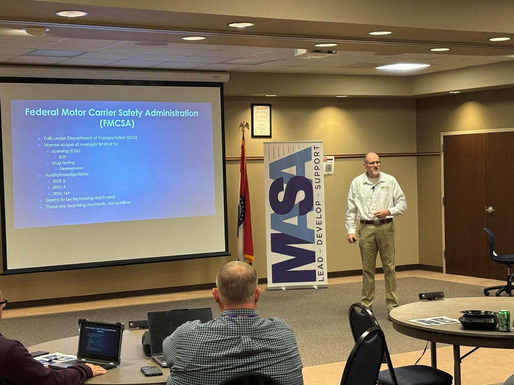 Participants listen in during the presentation