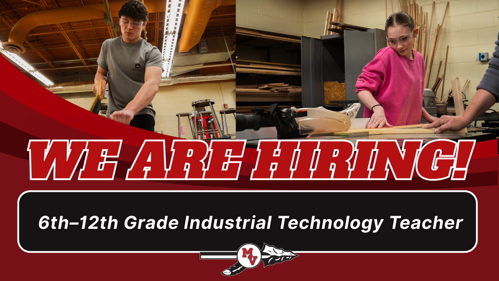 Students working in a industrial shop cutting wood. 