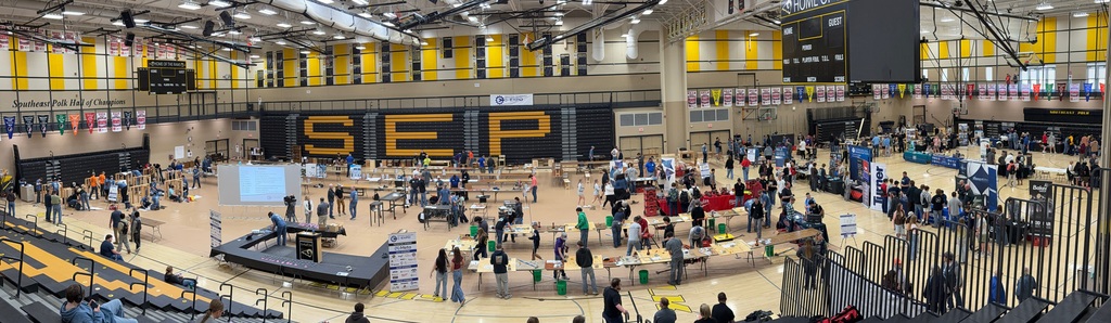 Gym filled with people and tables