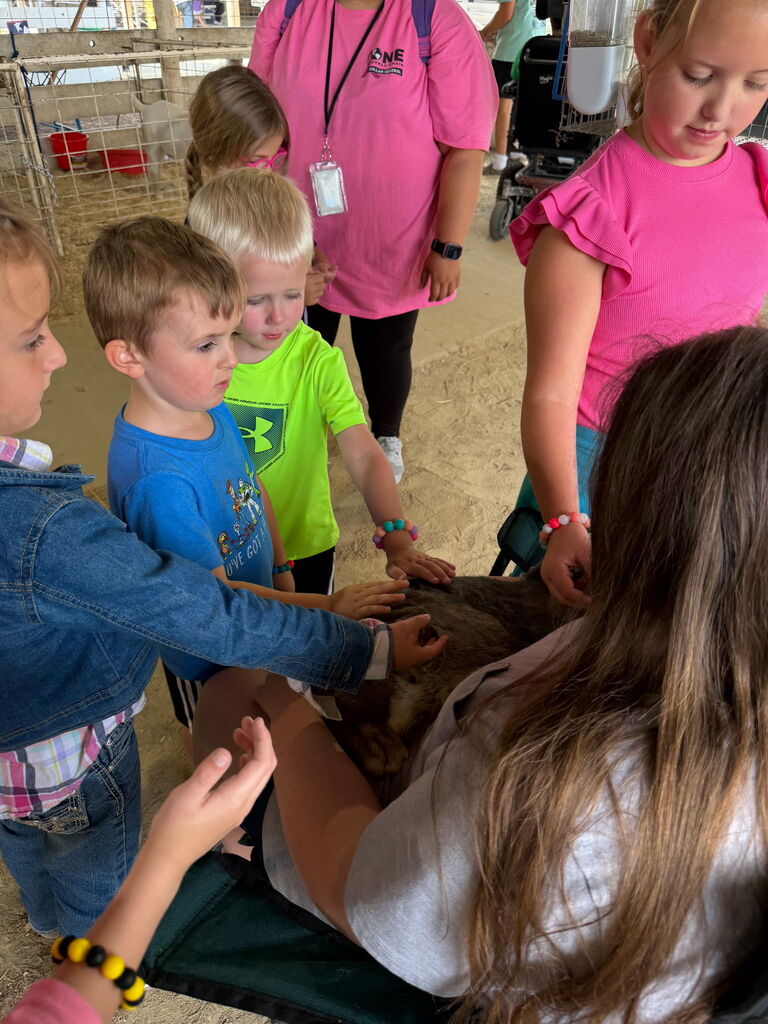 Kids petting an animal