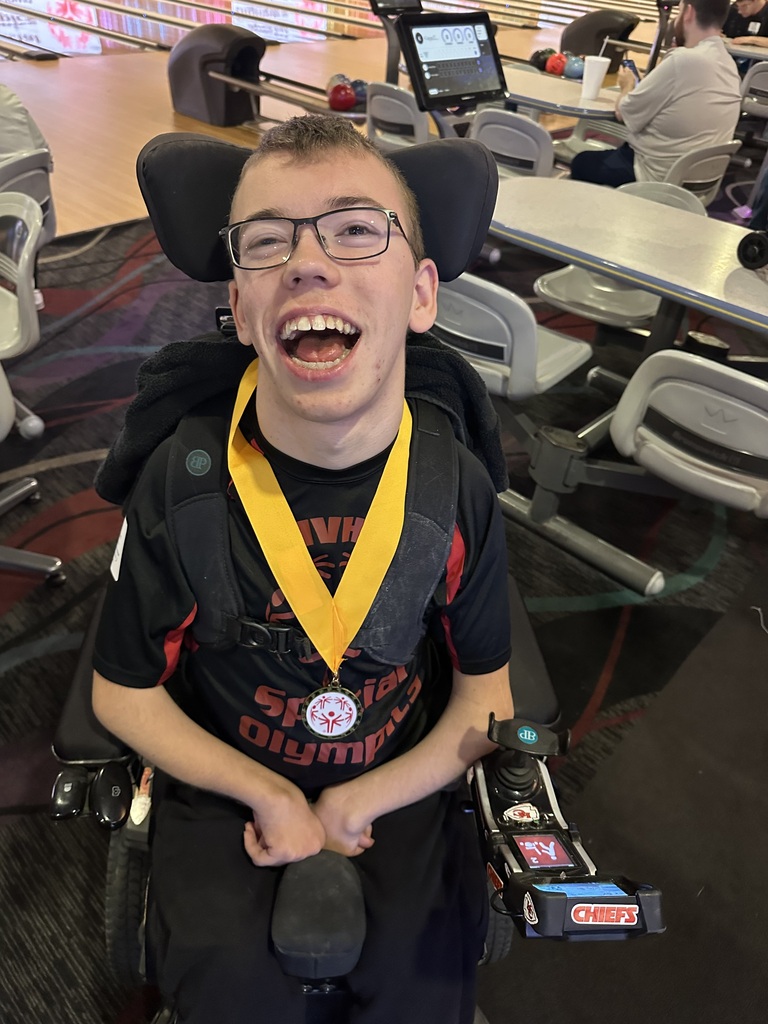 Child with medal around their neck