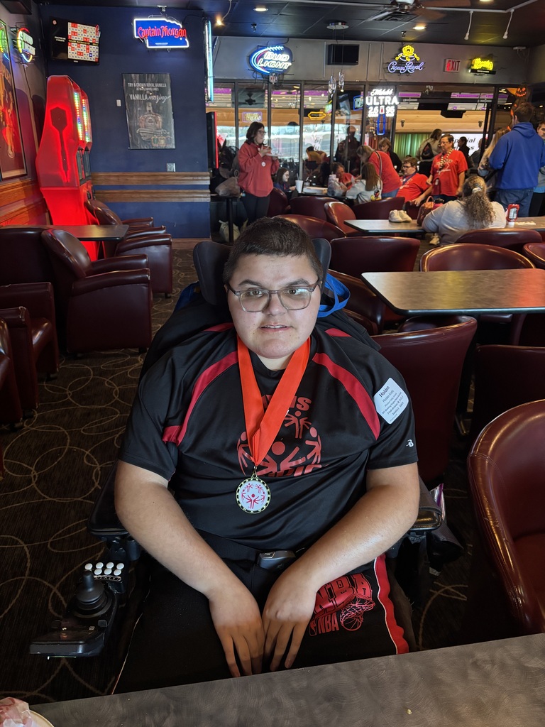 Child with medal around their neck