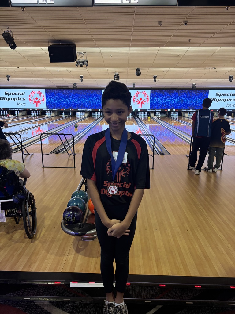 Child with medal around their neck
