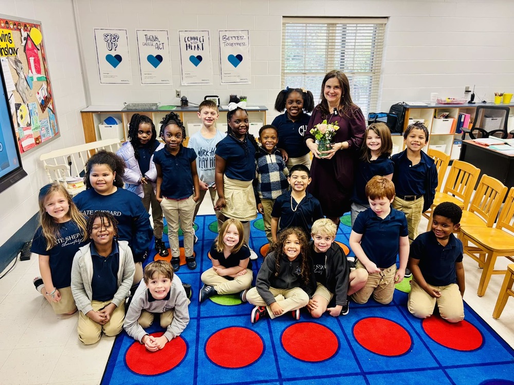 Kate Shepard students sitting on rug with teacher