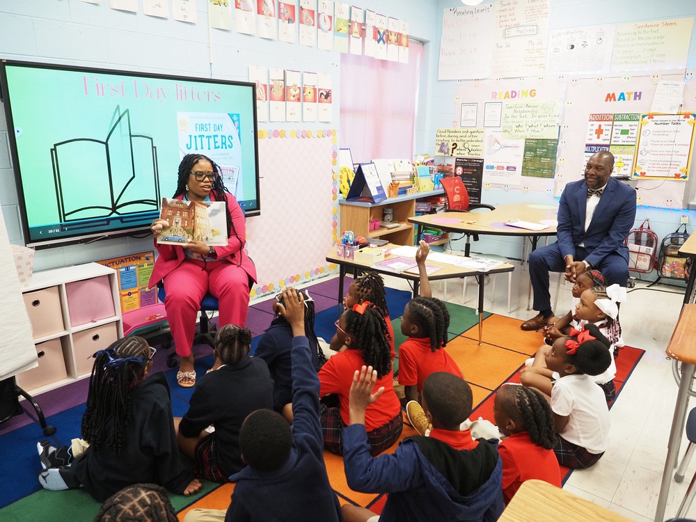 A teacher reads "First Day Jitters" to elementary students