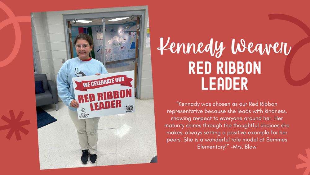 Kennedy Weaver holding red ribbon leader sign