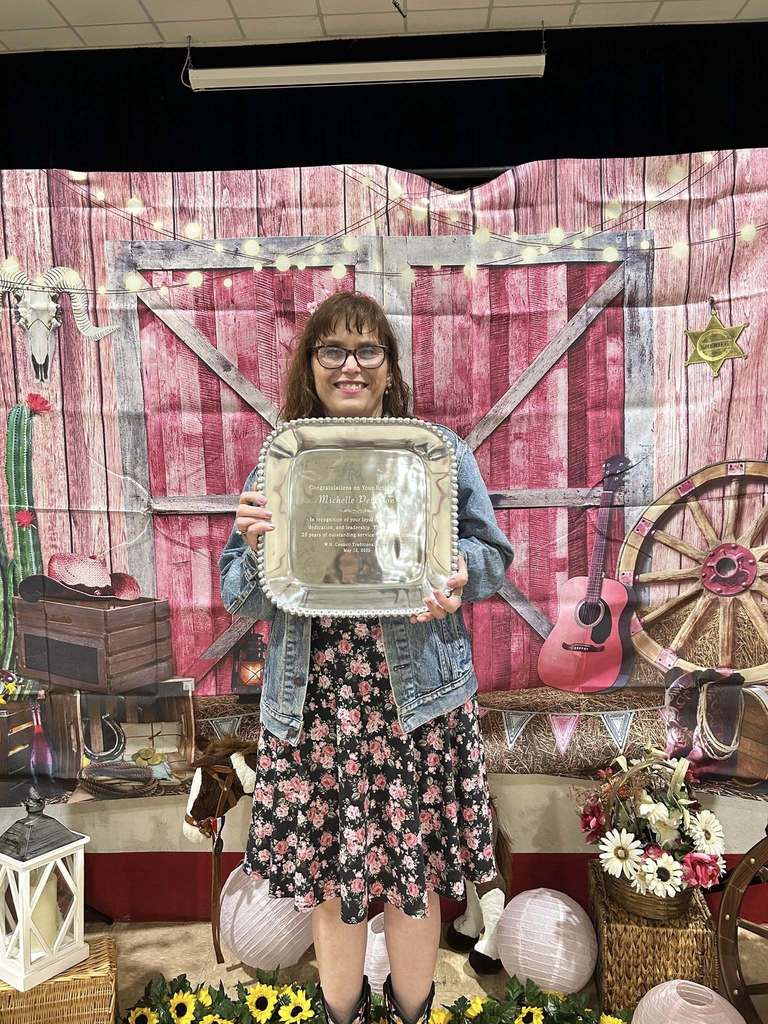 Michelle Peterson (29 years) holding retirement placque