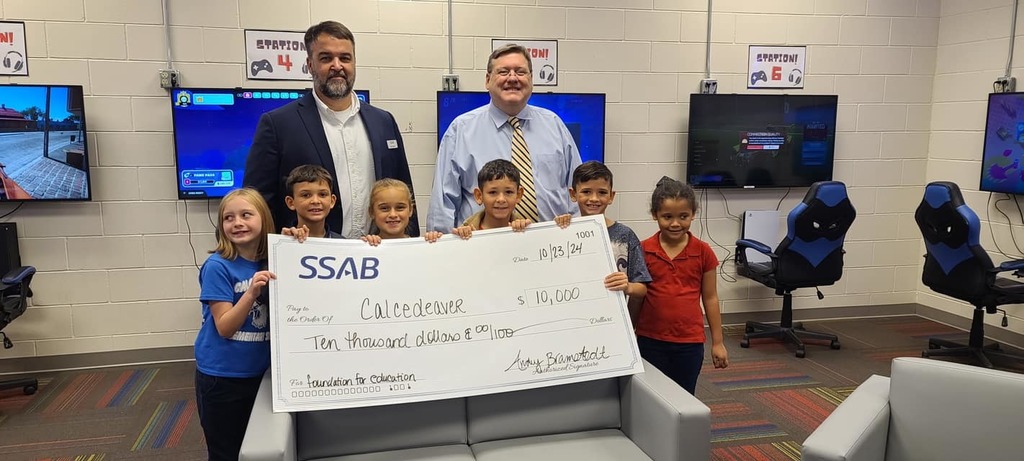Mr. Sullivan and students accept $10,000 check from SSAB
