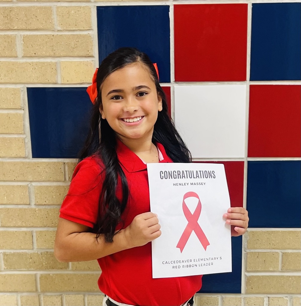 Henley Massey holding Red Ribbon award