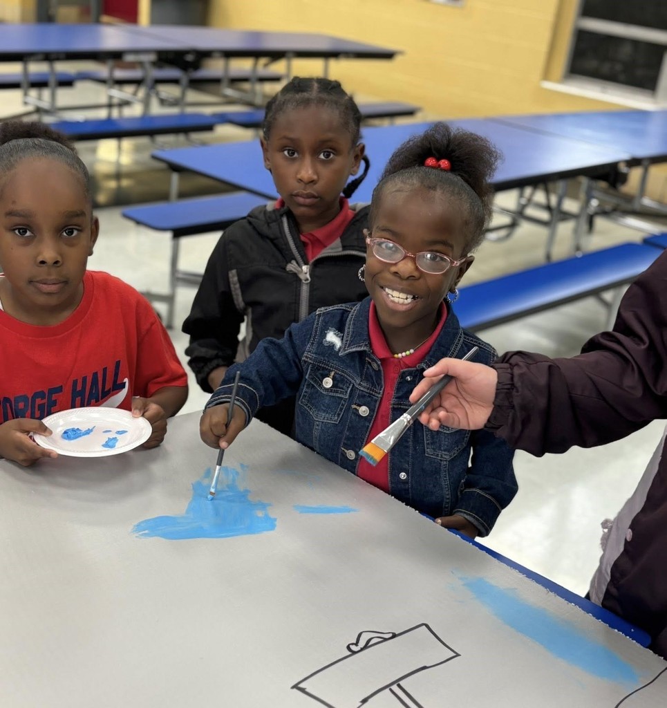 Three students painting