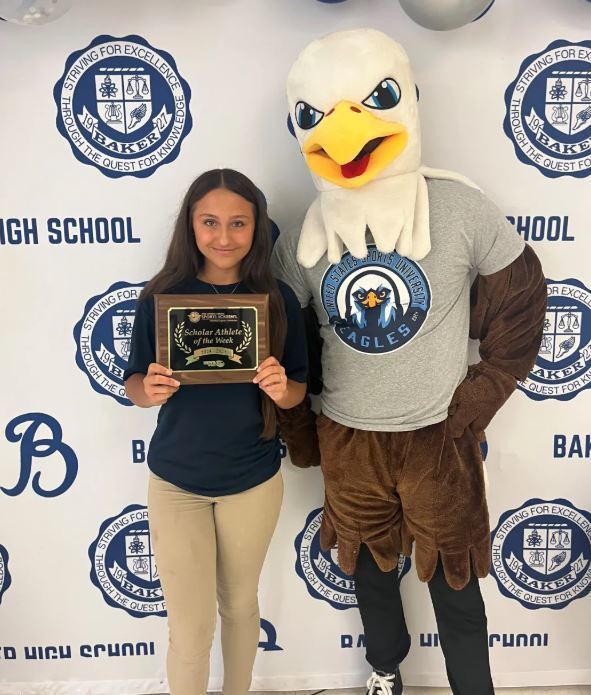 Kristina Lapeyrouse poses with the United States Sports University's eagle mascot