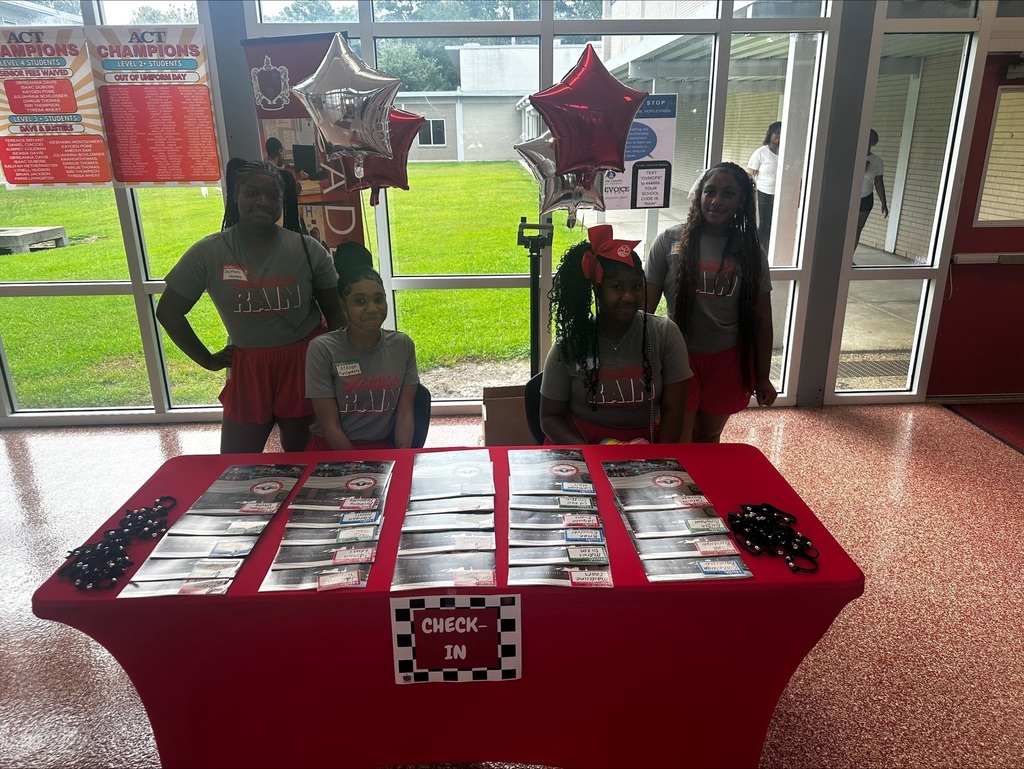Cheerleaders welcoming students during checkin.