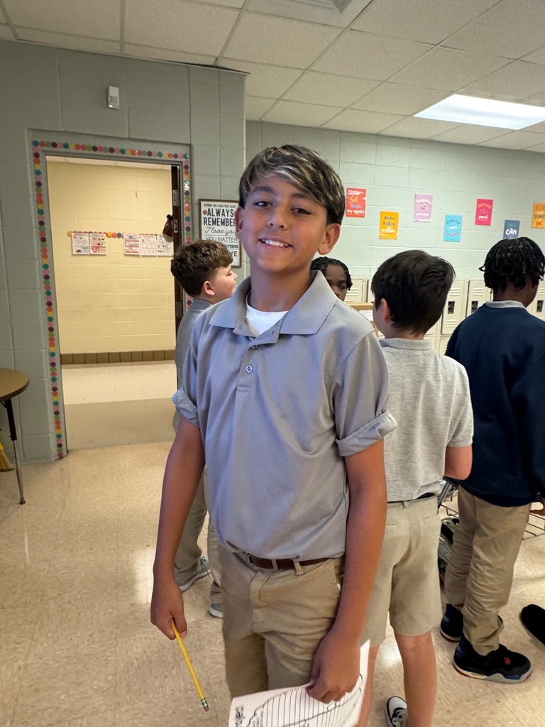 Student smiling in a classroom