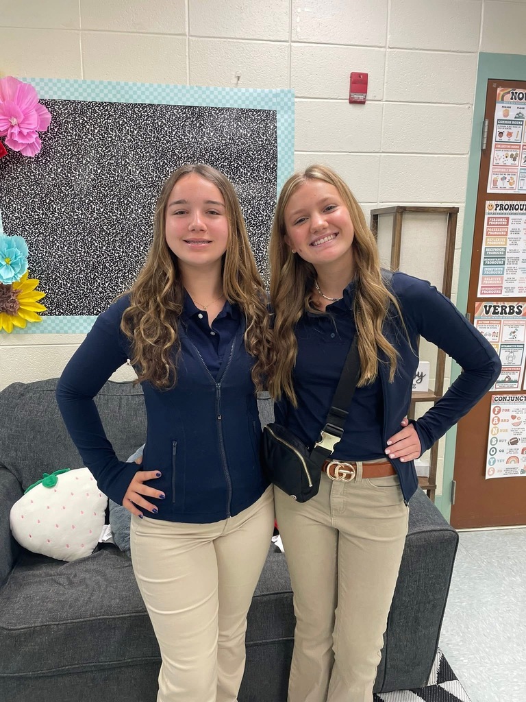 2 girls posing for a picture