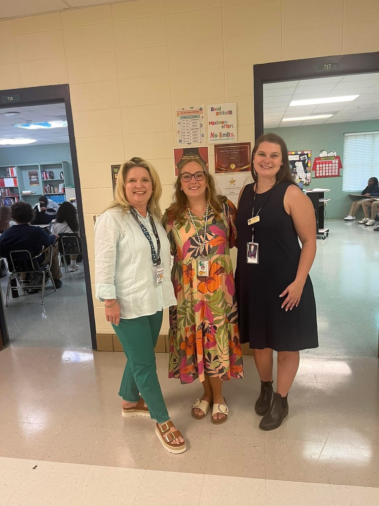 Teachers standing in a hallway