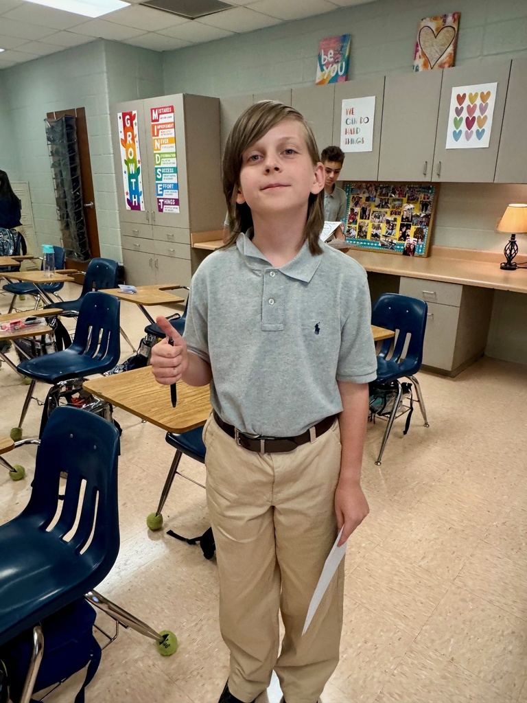 Student smiling in a classroom