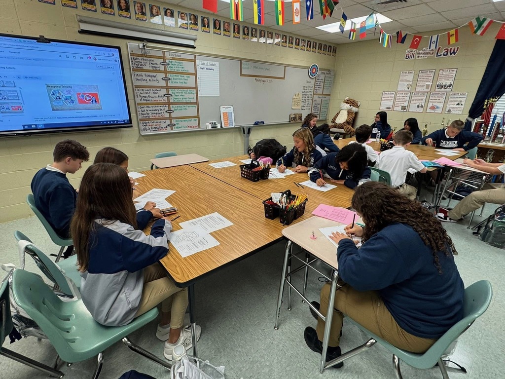 Group of students sitting at tables working